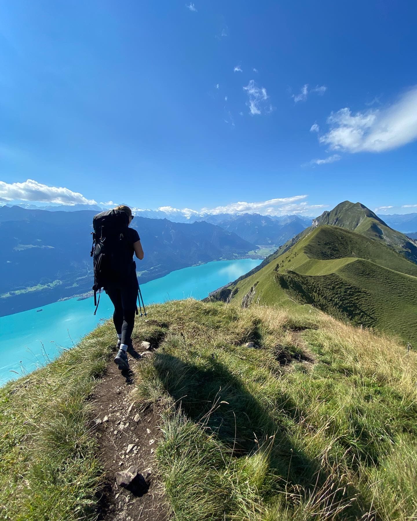 Hiking in Lauterbrunnen, hike to the turquoise blue lake, alpine meadows.