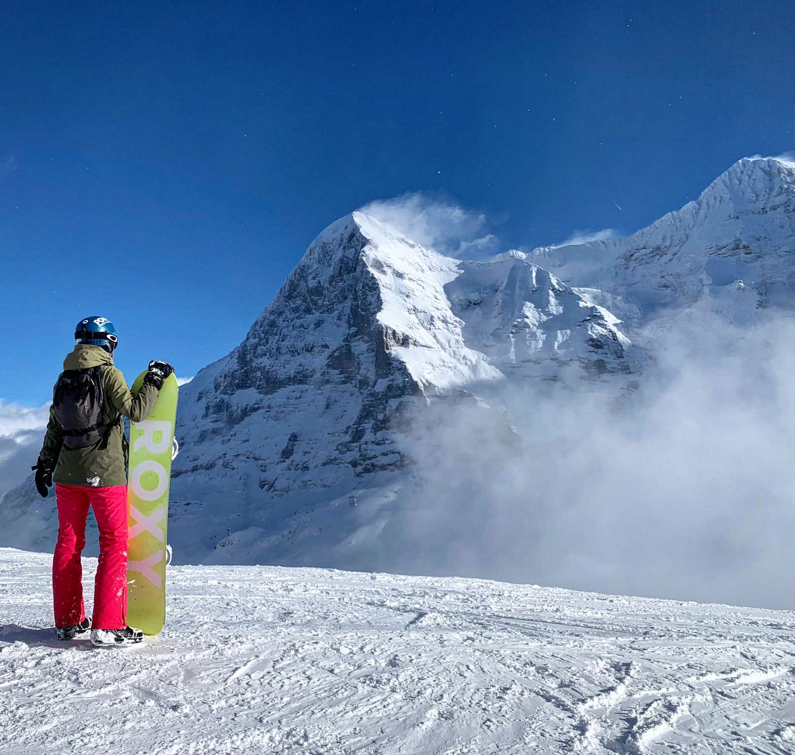 Snowboarding in Lauterbrunnen with a view of the Eiger in winter