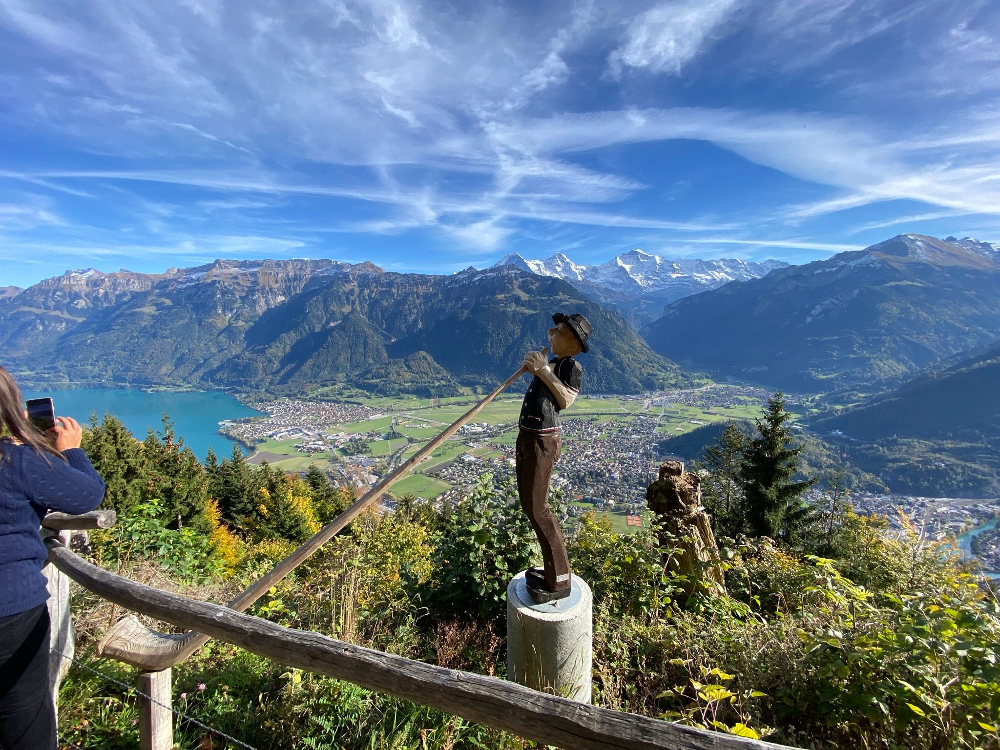 View of Lauterbrunnen with hiker and mountain landscape