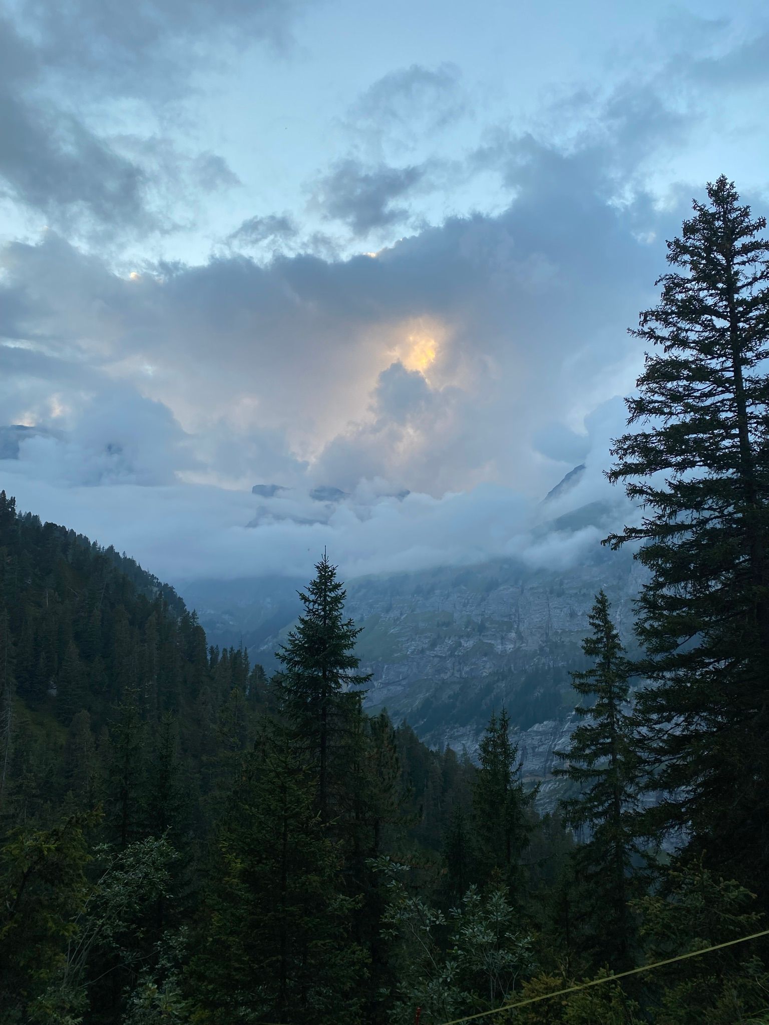 Lauterbrunnen clouds against the mountain backdrop, cool morning atmosphere