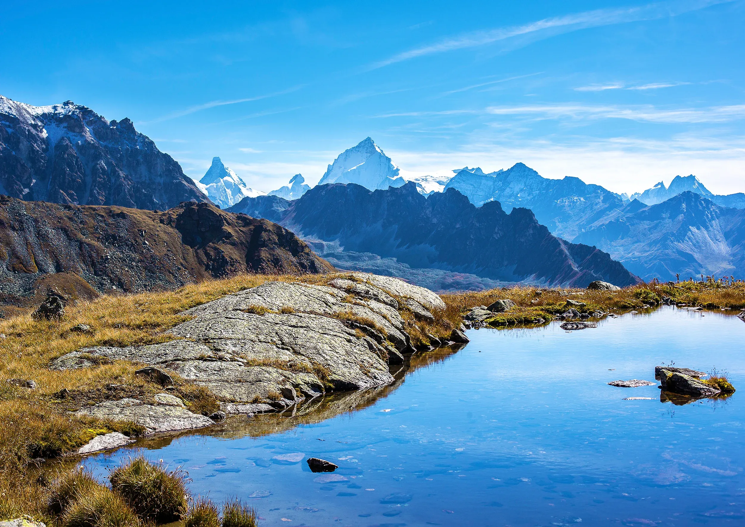 Grimentz with mountain panorama and water source