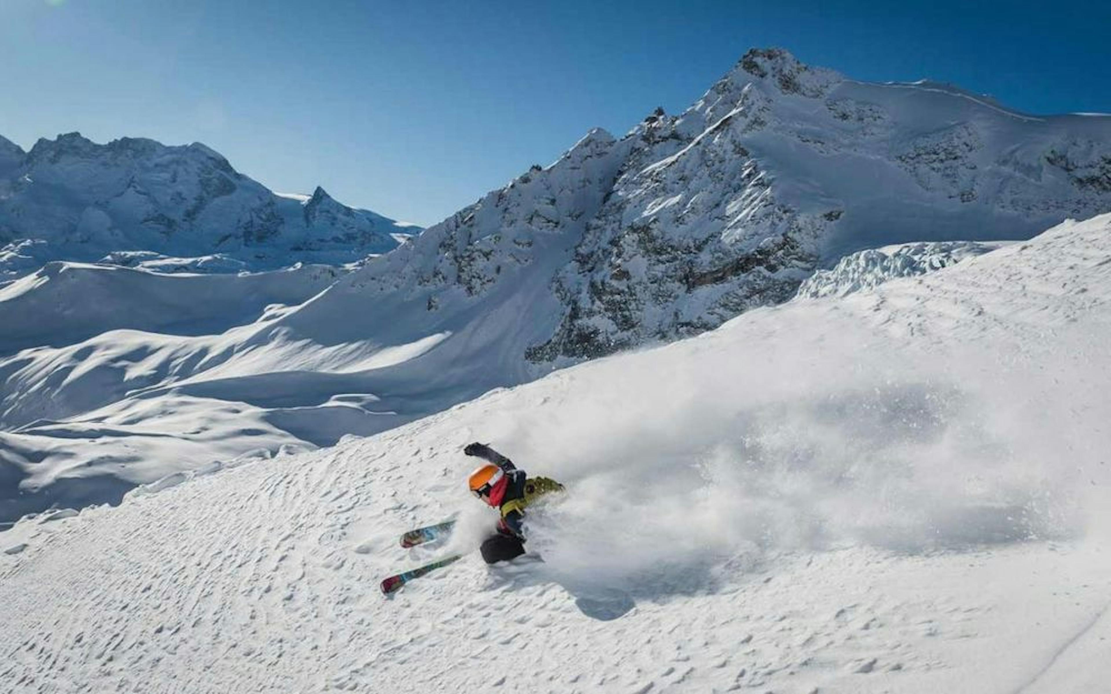Heliski skier deep snow