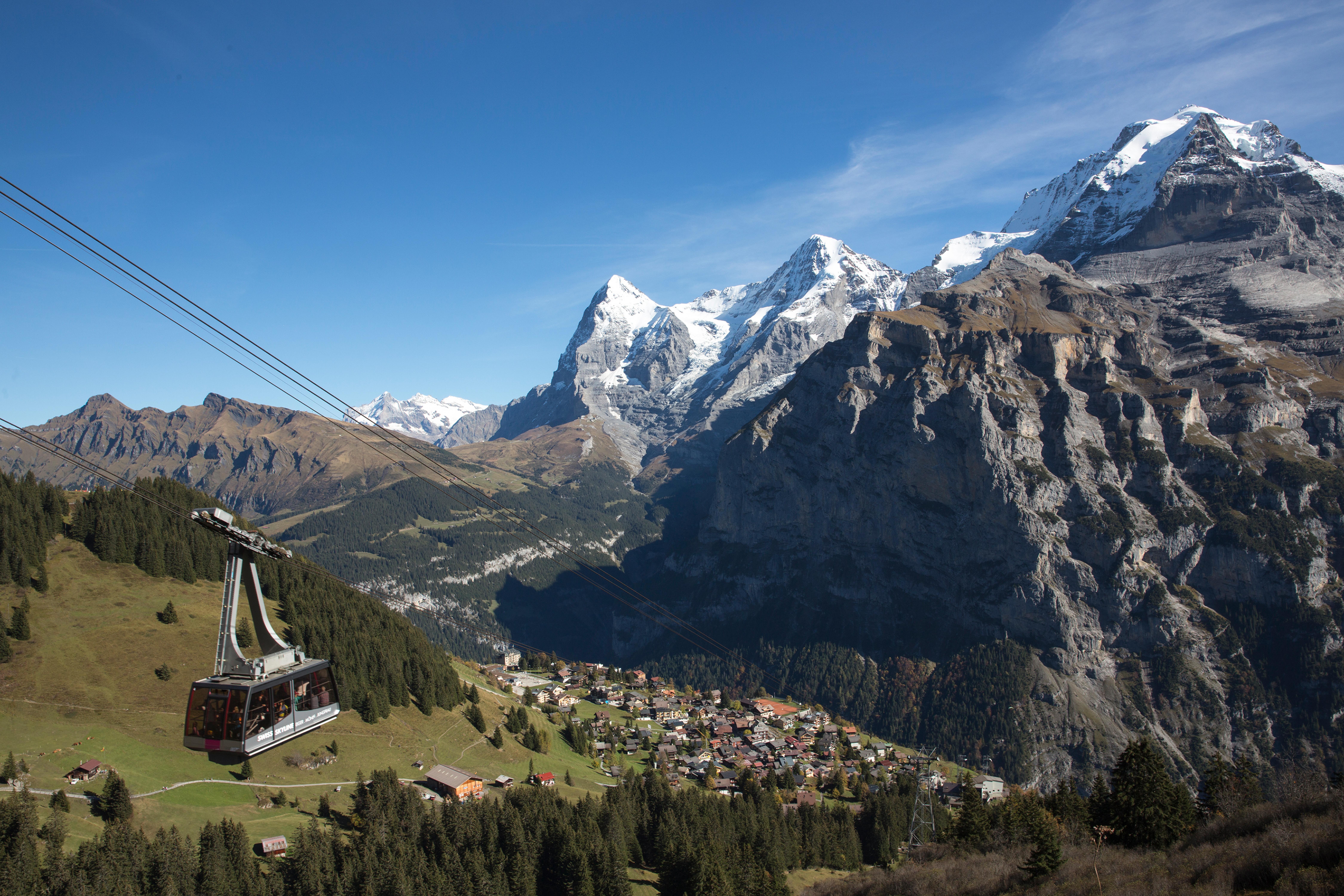Schilthorn: captivating view of the mountains, cable car, and picturesque village in summer.