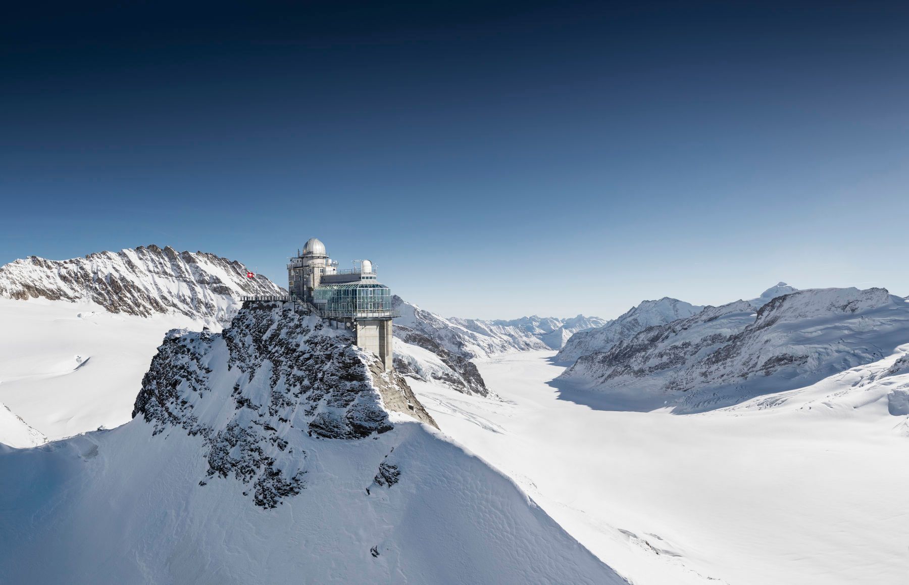 Jungfraujoch: highest railway station in Europe located in Switzerland with snow and mountains.